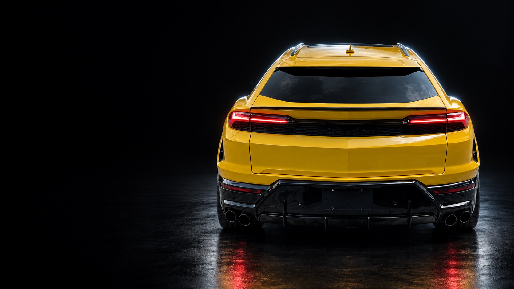 Lamborghini Urus SE, rear view in a dark studio concept
